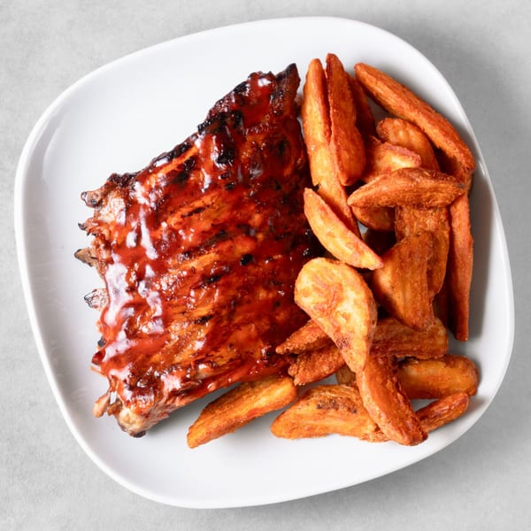 Ribs on the Run BBQ ribs with sweet and tangy sauce, served with crispy potato wedges.
